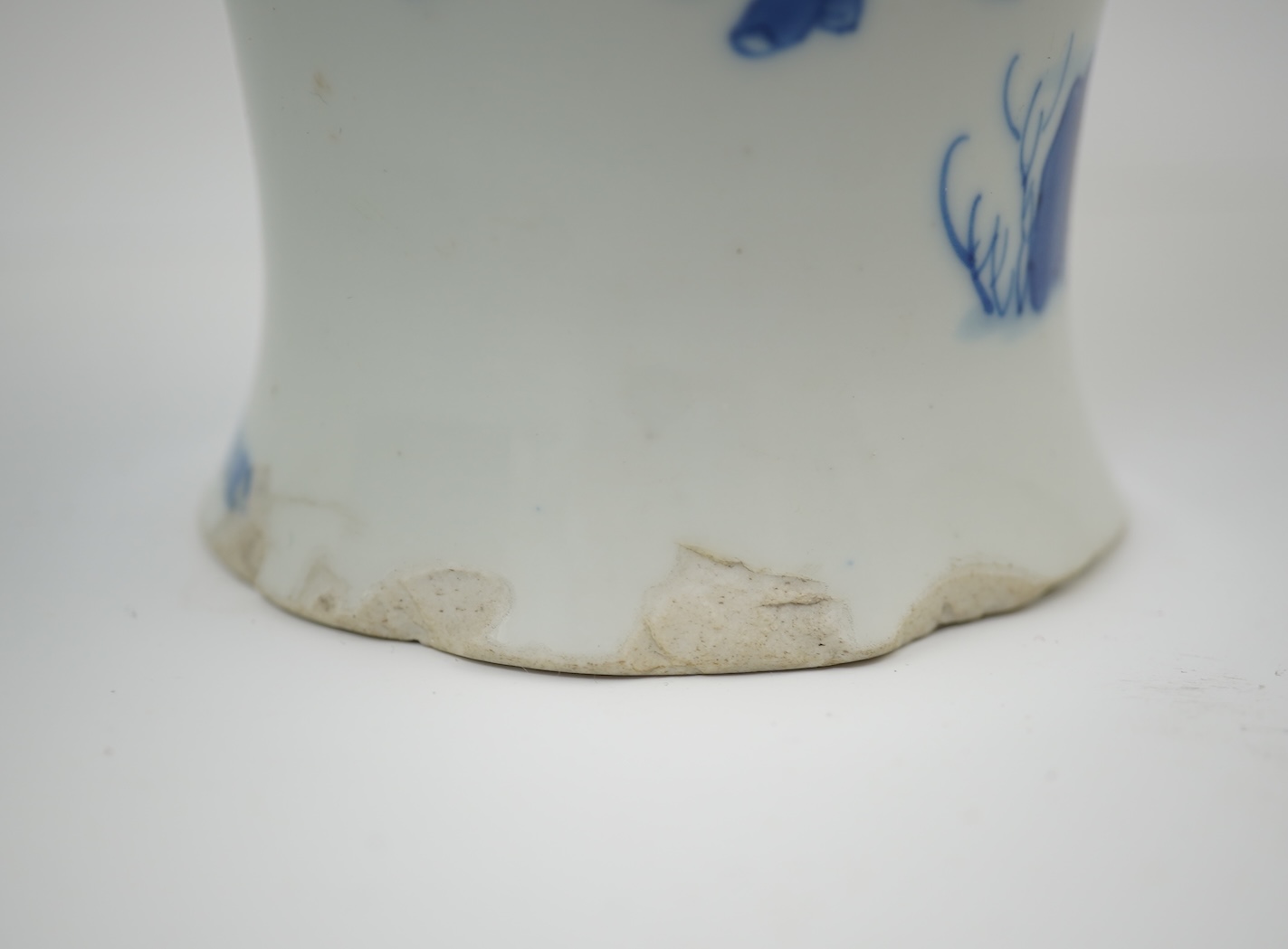 A Chinese blue and white baluster vase, early Kangxi, and associated cover
